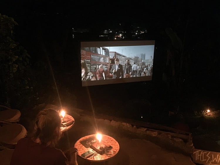 A movie plays at the outdoor theater in Pokhara, Nepal