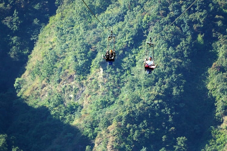 Michelle Della Giovanna from Full Time Explorer and a friend ride the Zip Flyer in Pokhara, Nepal - Places to visit in Pokhara