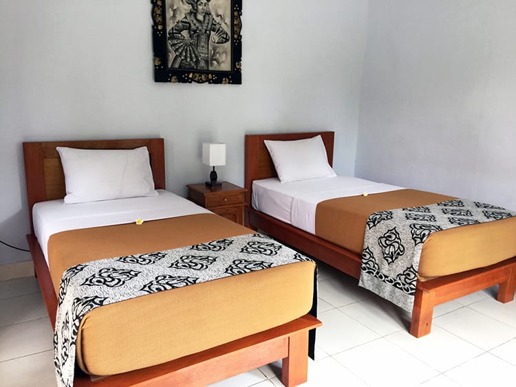 Two twin beds in a room in a homestay in Bali, Indonesia