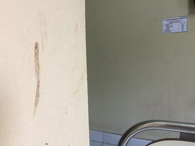 A mark on the wall that looks like smeared blood