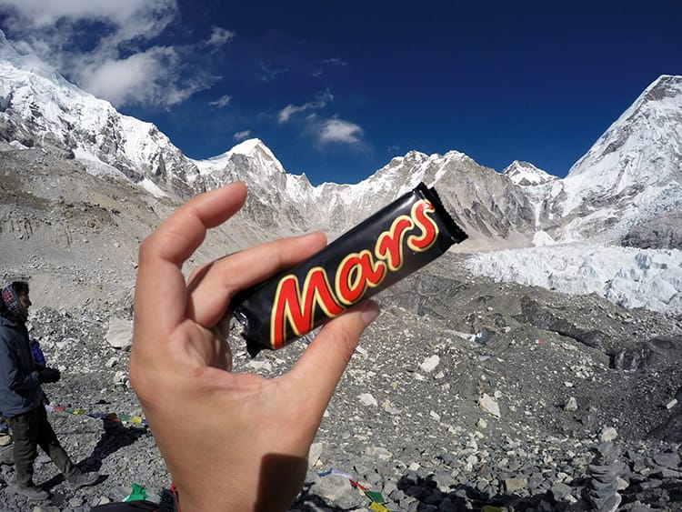 A Mars bar held up at Everest Base Camp as a celebratory snack
