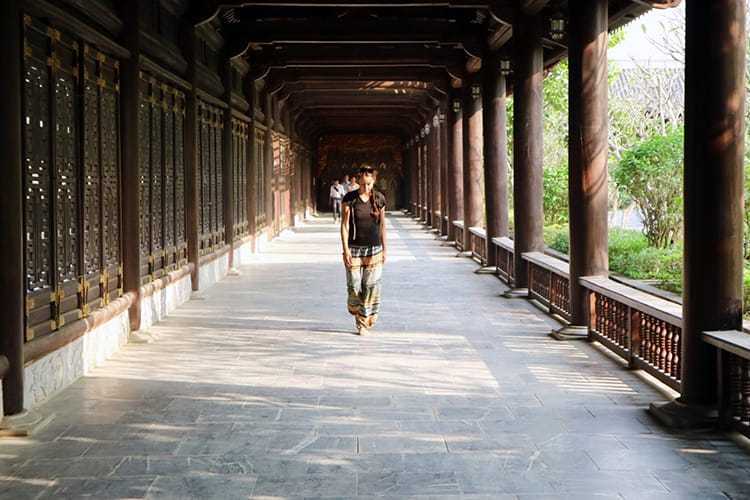 A women walking down the hall at Bai Dinh Pagoda in Tam Coc Vietnam