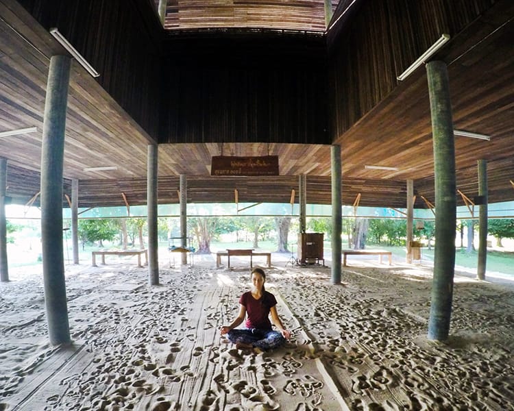 Michelle Della Giovanna from Full Time Explorer sits in a meditation pavilion on Thailand