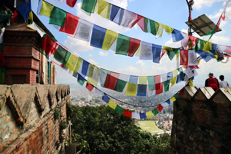 The view from the Monkey Temple in Kathmandu with prayer flags hanging from above