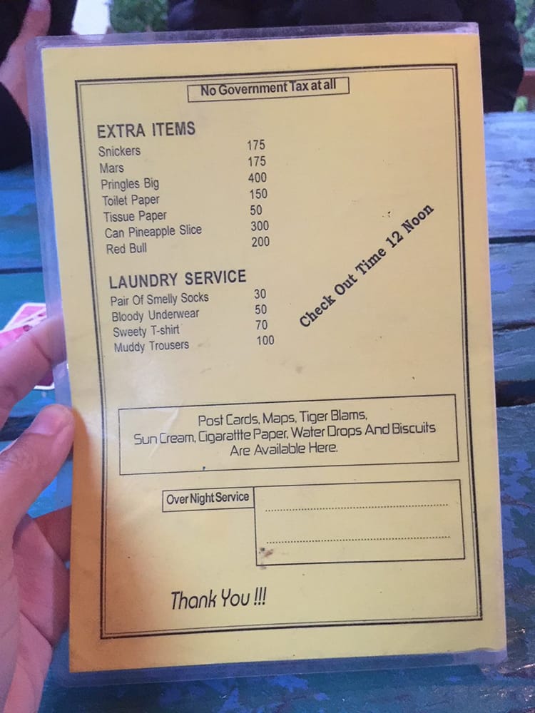 A pricing menu on the Annapurna Circuit that says "stinky socks, bloody underwear, sweaty t-shirt, muddy trousers"