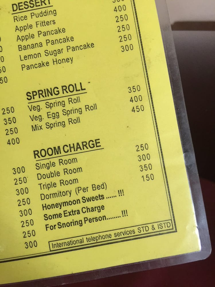 A price list on the Annapurna Circuit that says "some extra charge for snoring person"