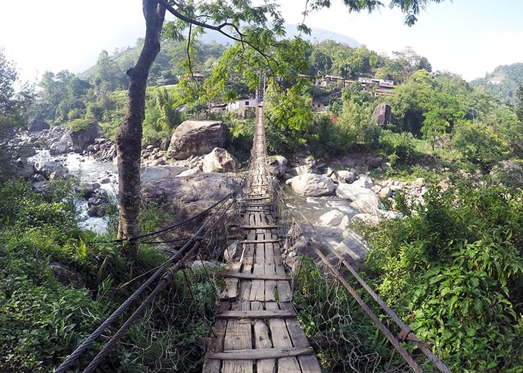 An old wood suspension bridge in Bhulbhule