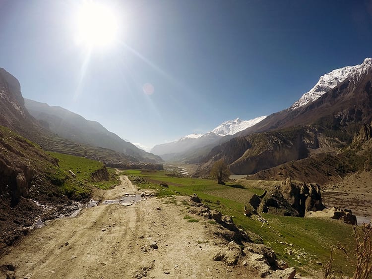 A dirt road leaving Manang cuts through the hills of the Annapurna Circuit