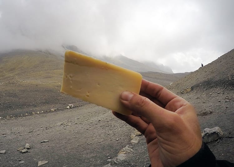 A chunk of yak cheese held up at Thorong La Pass on the Annapurna Circuit