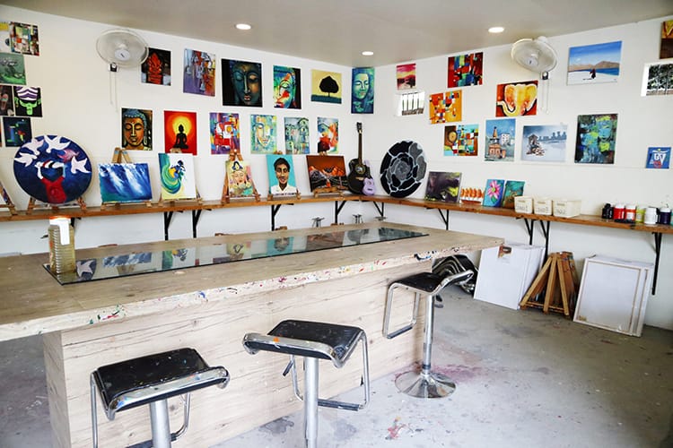 Inside the House of Palettes painting studio where art lines the walls