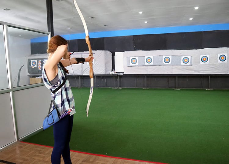 Michelle Della Giovanna from Full Time Explorer practices archery at The Best Archery in Patan