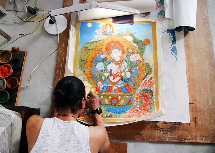 Kichaa Chitrakar of the Newari caste paints an elaborate Thangka painting