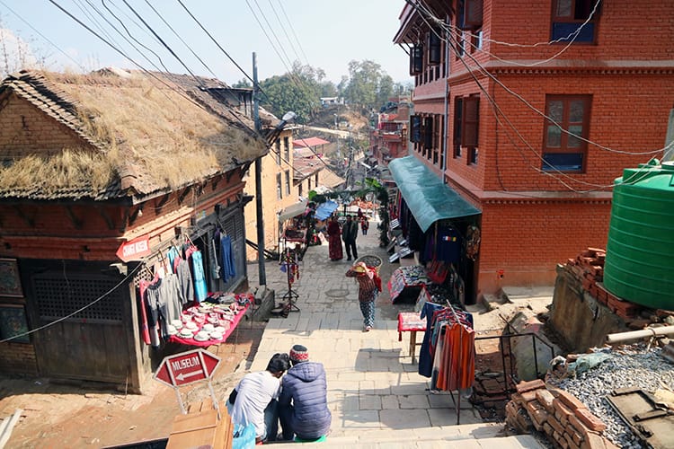 Villagers go about their days in the town of Changu Narayan which has no access to cars on it's tiny stone streets