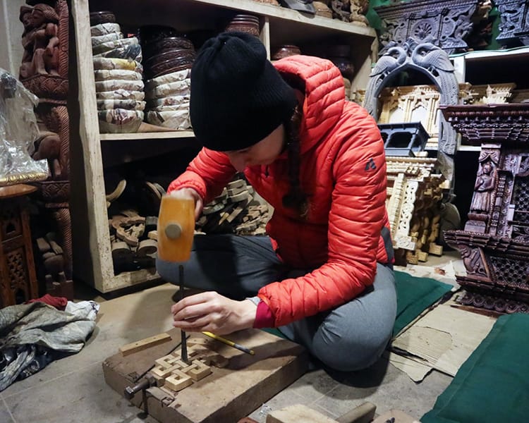 Michelle Della Giovanna from Full Time Explorer takes a wood carving class in Bhaktapur at Nyatapola Guest House