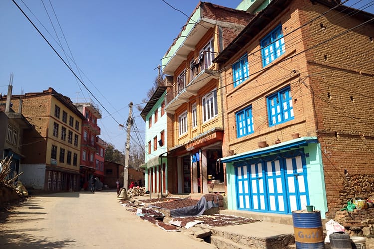 Brightly colored buildings line the streets on the way to Panauti Nepal