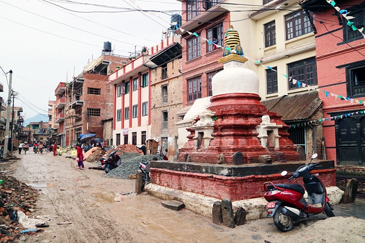 People walk down the street in Bungamati, Nepal