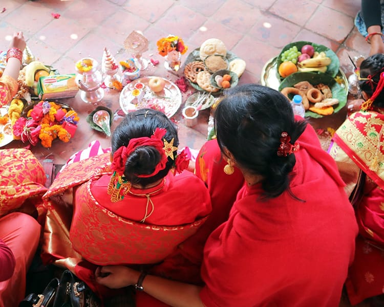 A mother and daughter perform puja together in Kathmandu Durbar Square
