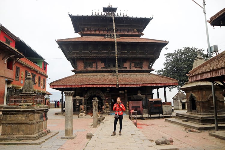 A woman standing in front of Baghbhairab Temple in Kirtipur Nepal