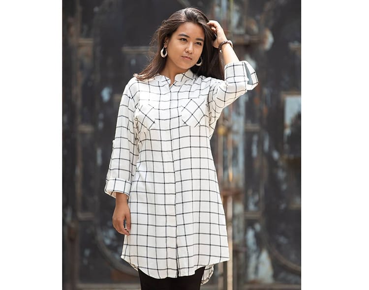 A plaid tunic made by Danfe Works which makes Nepali clothing products