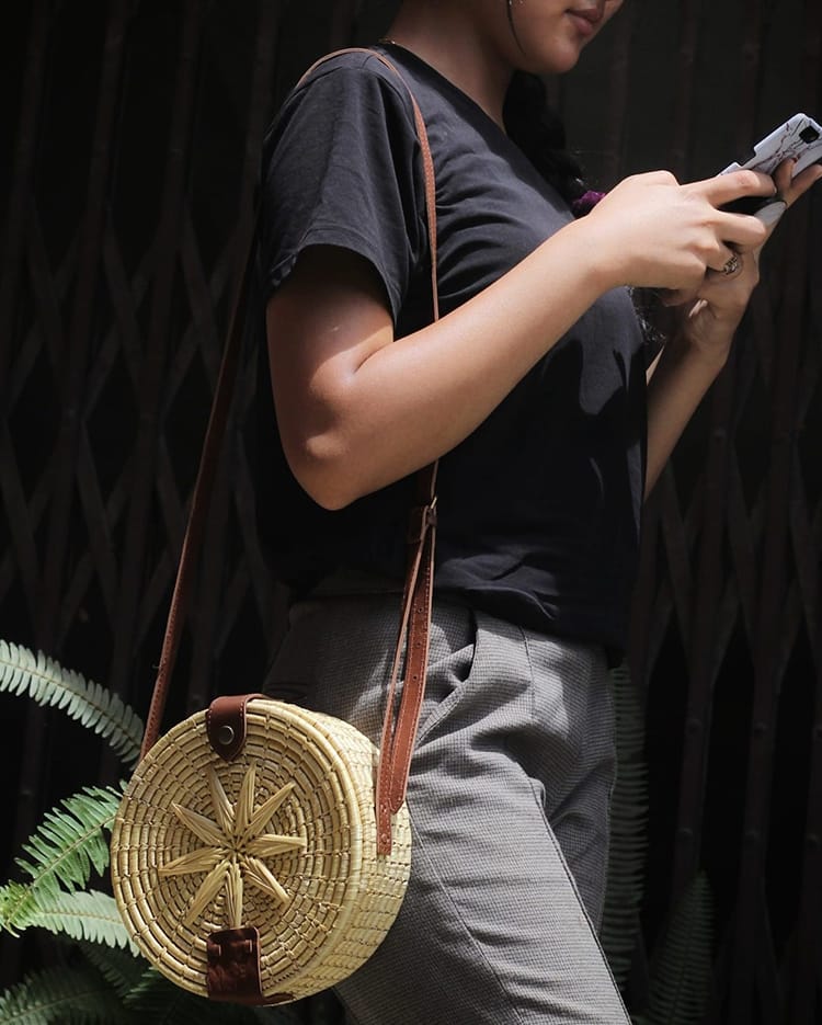 A round hand woven women's purse made by Nepal Knotcraft Centre