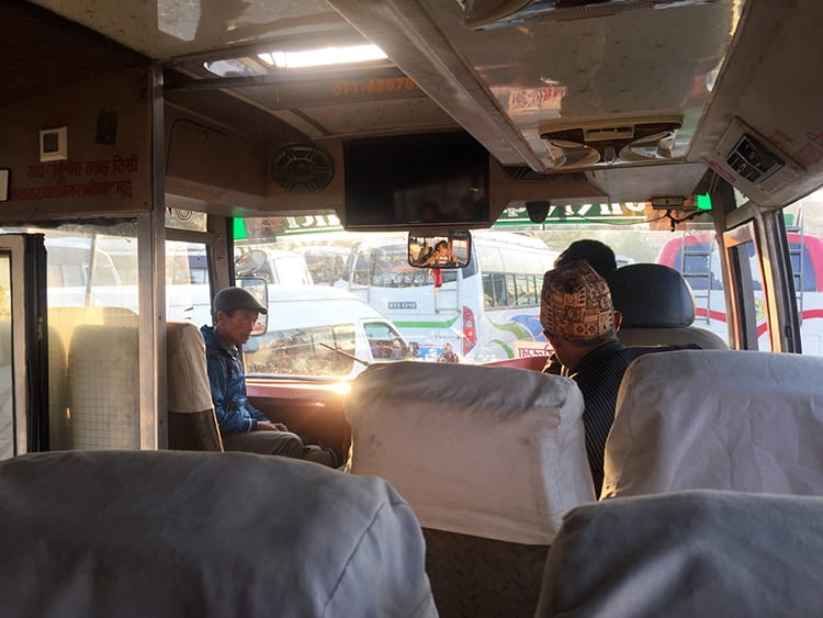 People board a bus from Kathmandu to Singati Bazaar in Nepal