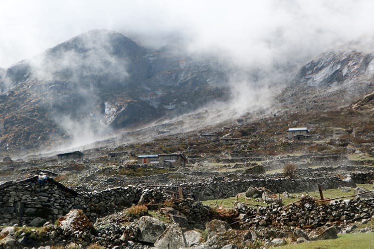Rain turns to clouds as it evaporates off the mountains in Na, Nepal