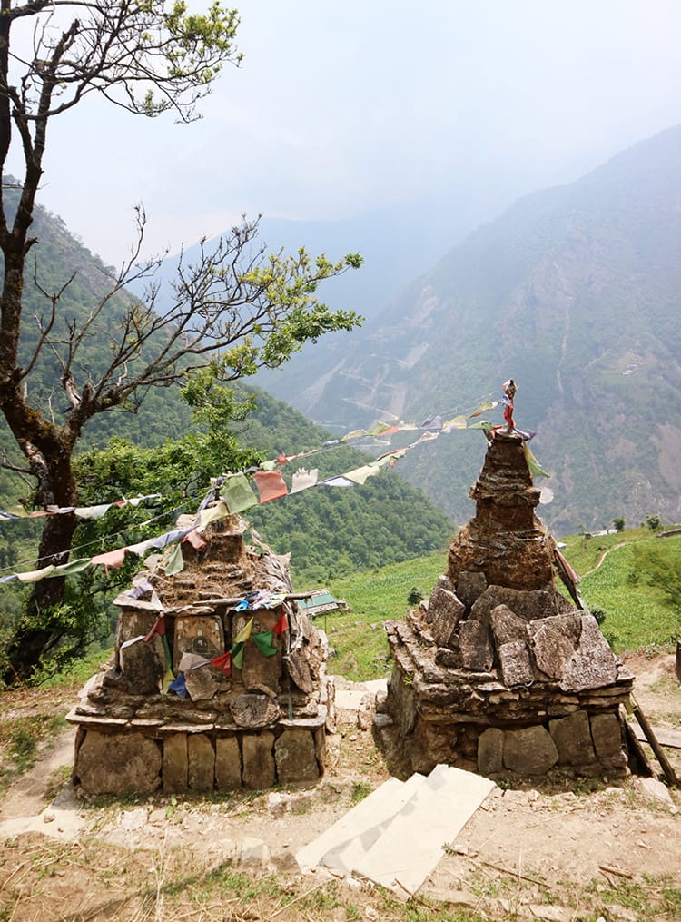Two Buddhist stupas with a view are in the middle of the walking trail, offering travelers a place to sit and pray