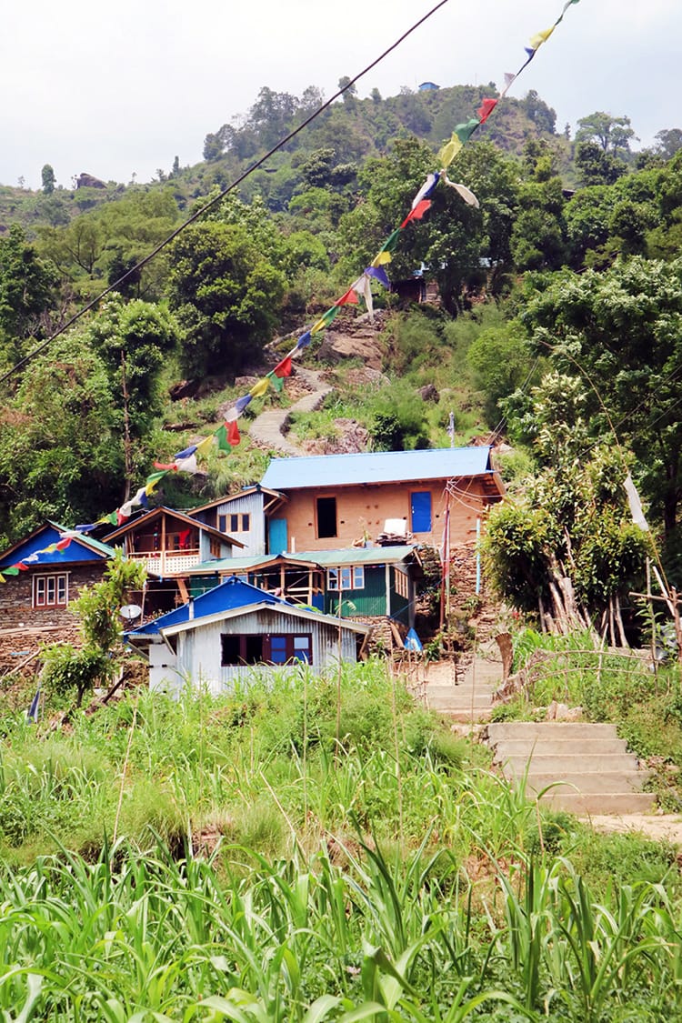 Houses appear to be stacked on each other on the steep hills of Simigaun