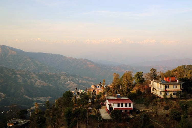 The Himalaya mountains in soft shades of pink and purple during the sunrise at Dhulikhel