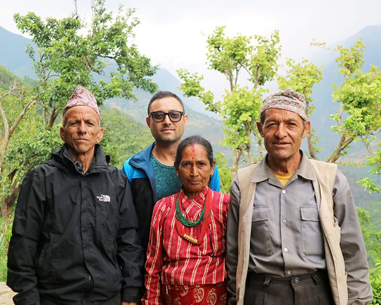 Suraj Pradhan poses with long lost family members in front of the Himalayas