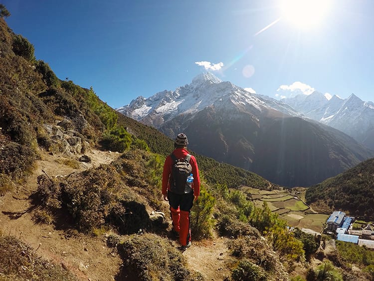 Michelle Della Giovanna from Full Time Explorer walks on a small path on the way to Everest Base Camp in Nepal