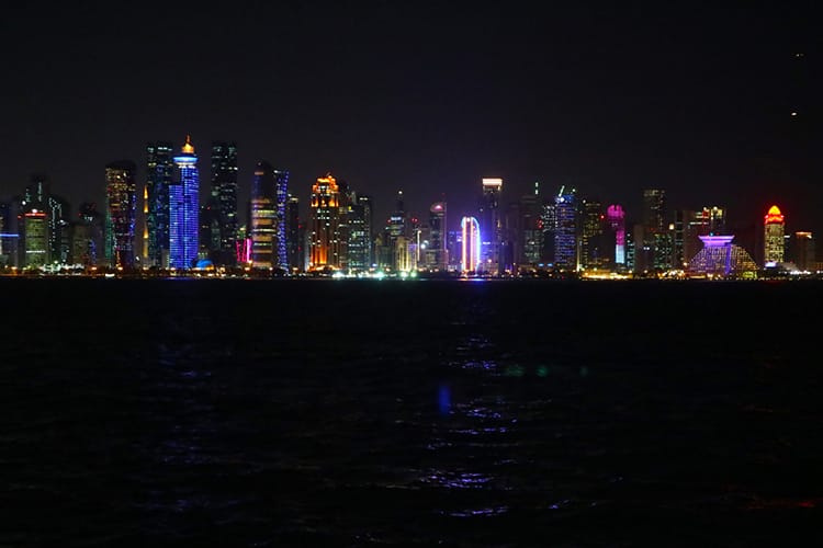 Doha, Qatar skyline at night seen from Dhow Harbor
