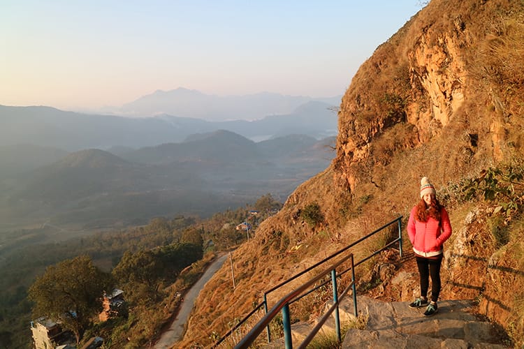 Michelle Della Giovanna from Full Time Explorer walks up to Thani Mai Temple in Bandipur at Sunrise