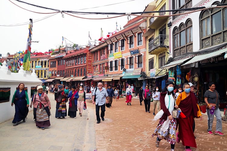 People Walking Around Boudhanath Stupa which is one of the most popular places to visit in Kathmandu, Nepal.