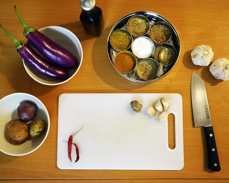 Raw ingredients used to make Nepalese style dry brinjal curry