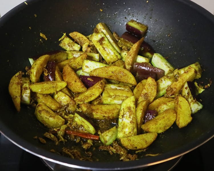 Once the eggplant is added to the curry in the fry pan before it cooks