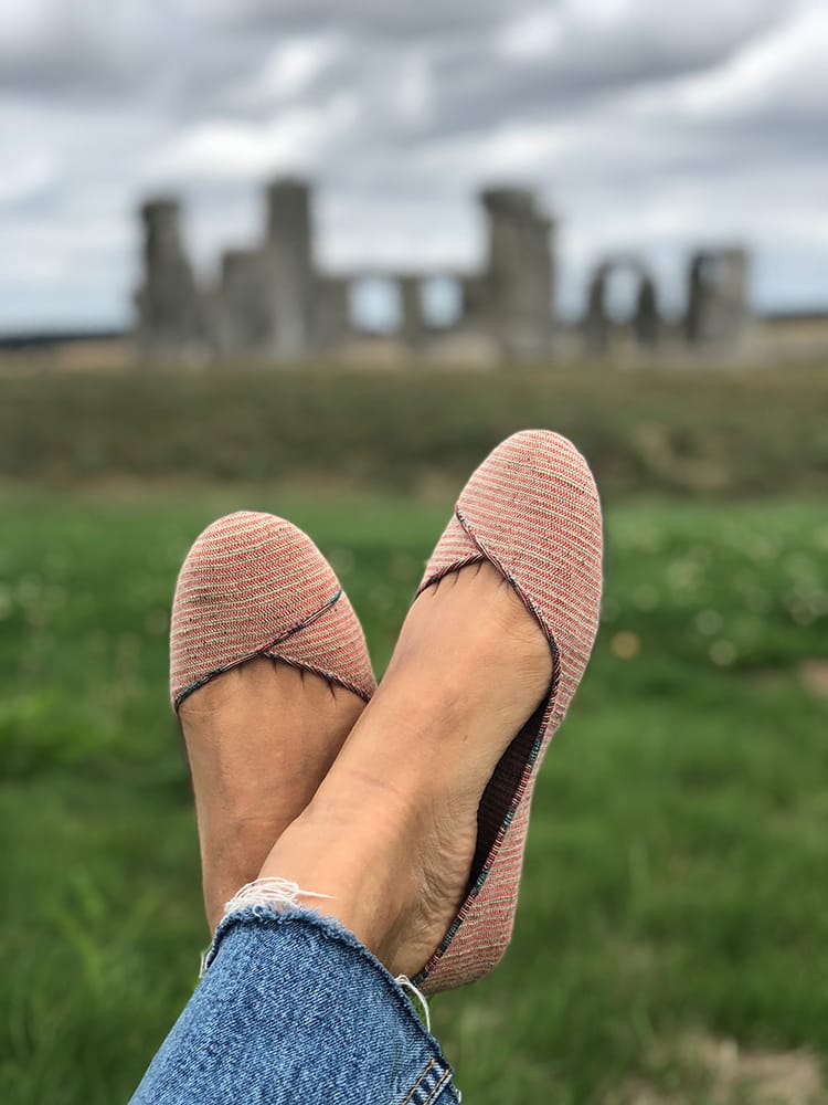 A pair of Paila Nepal shoes being worn in front of Stonehenge