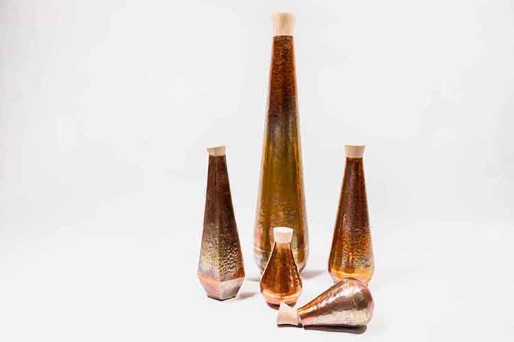 Hand made copper vases in varying sizes made by Pia Nepal
