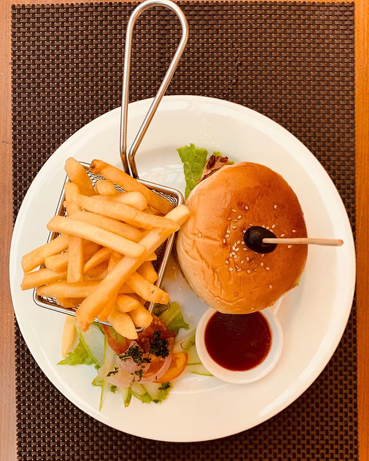 A chicken burger with fries at Rumi's Bistro in Kathmandu
