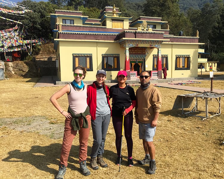 Michelle Della Giovanna from Full Time Explorer and friends stand in front of Nagi Gompa Monsatery