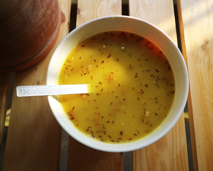 A bowl of yellow dal, ready to serve