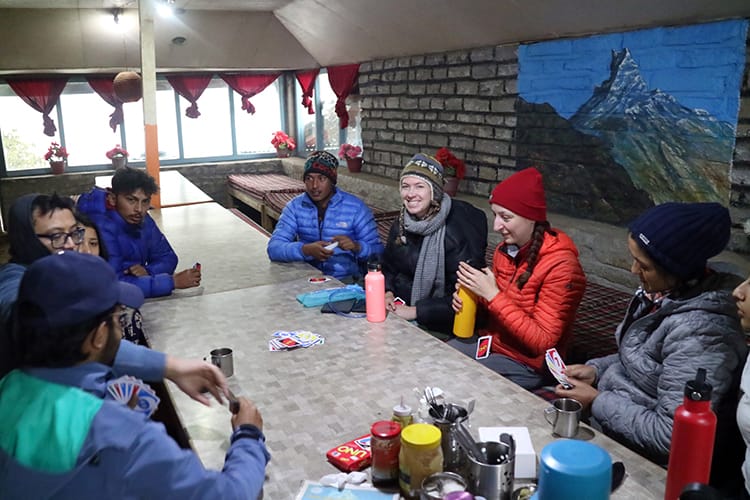 A group of trekkers place UNO along the Mardi Himal Trek