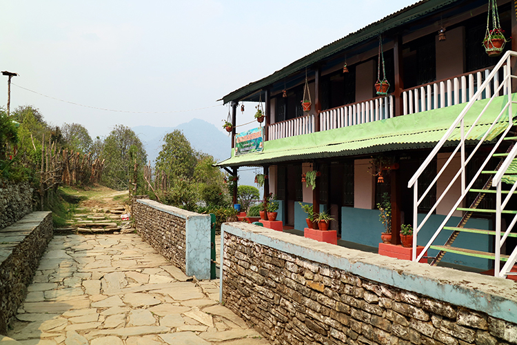 The last teahouse in Pothana, Nepal before leaving town which is brightly painted