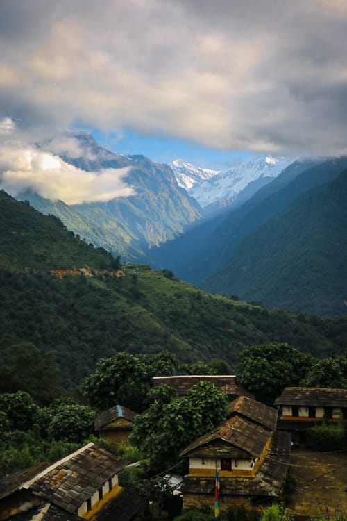 Mountains poking through the clouds in Ghandruk