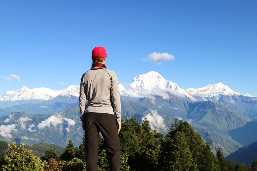 Michelle Della Giovanna from Full Time Explorer look at the Annapurna Range view from Poon Hill Trekking Route