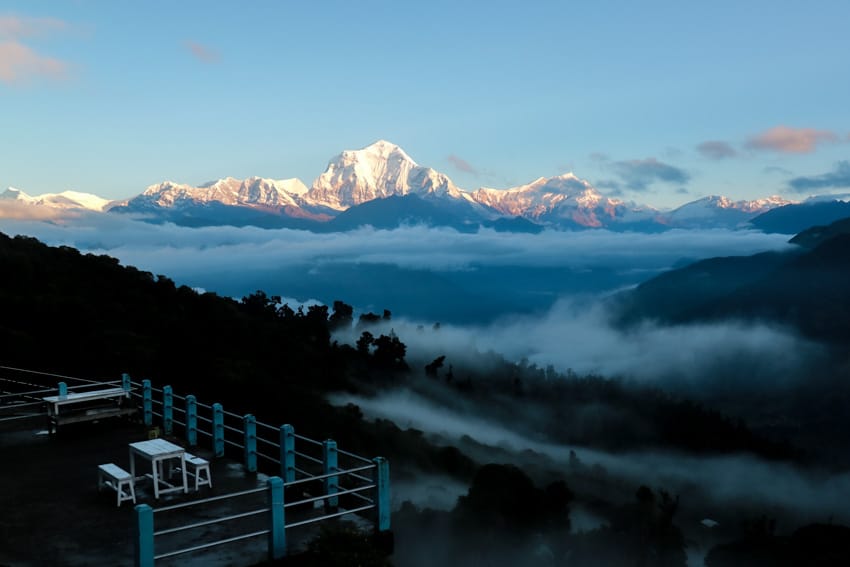 Tables overlook the Himalaya mountains in Ghorepani at sunrise
