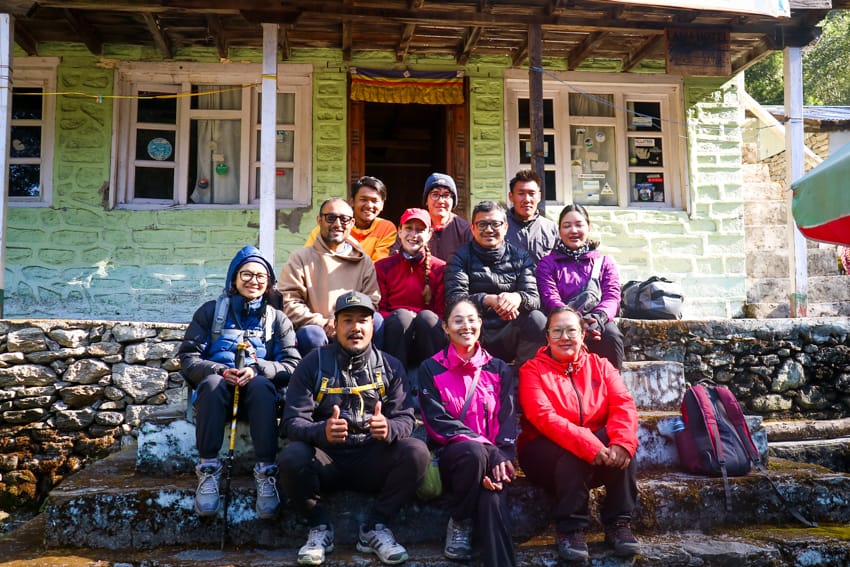 A group of trekkers in front of Jungle View Lodge in Lama Hotel