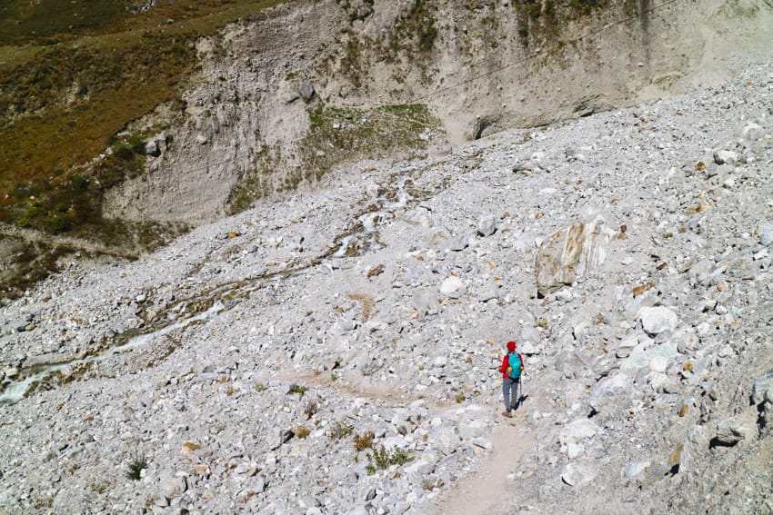Michelle Della Giovanna from Full Time Explorer walks over the Langtang village landslide