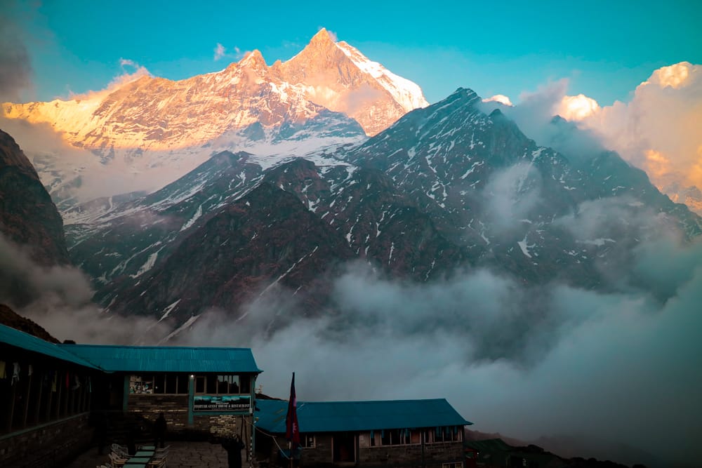 The Himalaya mountains behind some of the teahouses in Machhapuchhre Base Camp