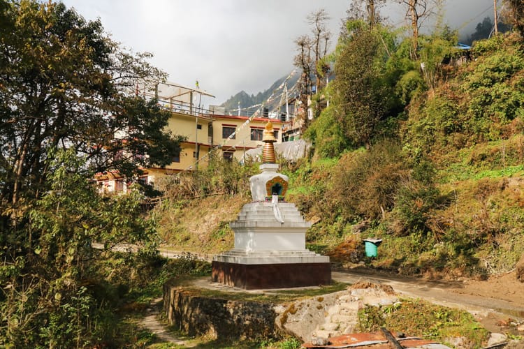 A buddhist stupa sits by the road in Tarkeghyang Nepal